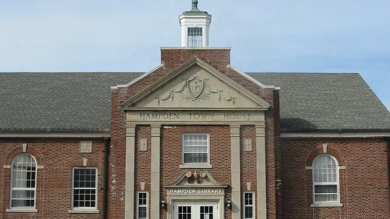 Brick Colonial Revival Hampden Town House and public library beneath a white cupola, Hampden, Massachusetts