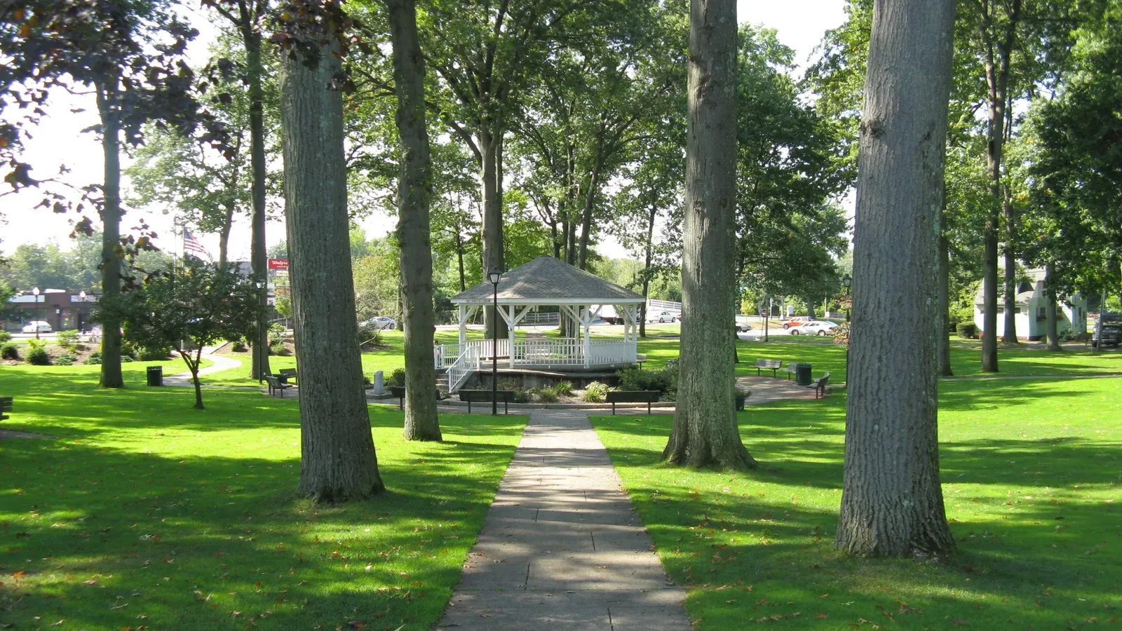White gazebo on the tree-shaded town green, Ludlow, Massachusetts