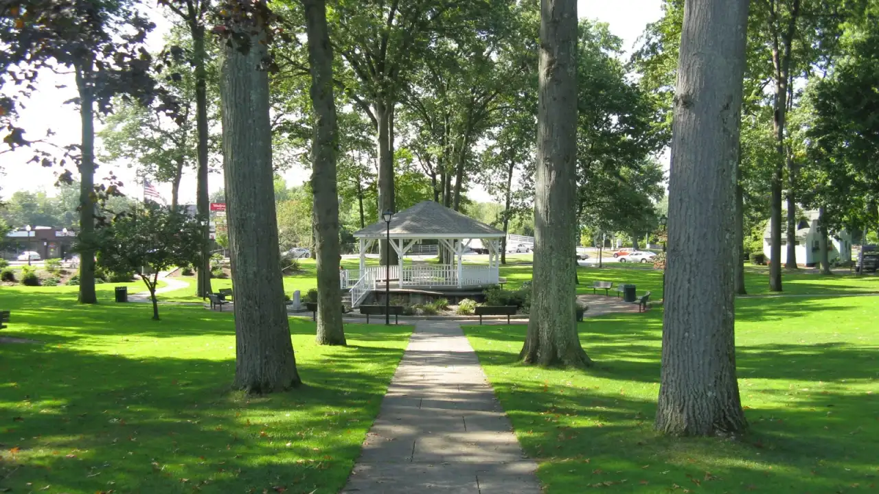 White gazebo on the tree-shaded town green, Ludlow, Massachusetts